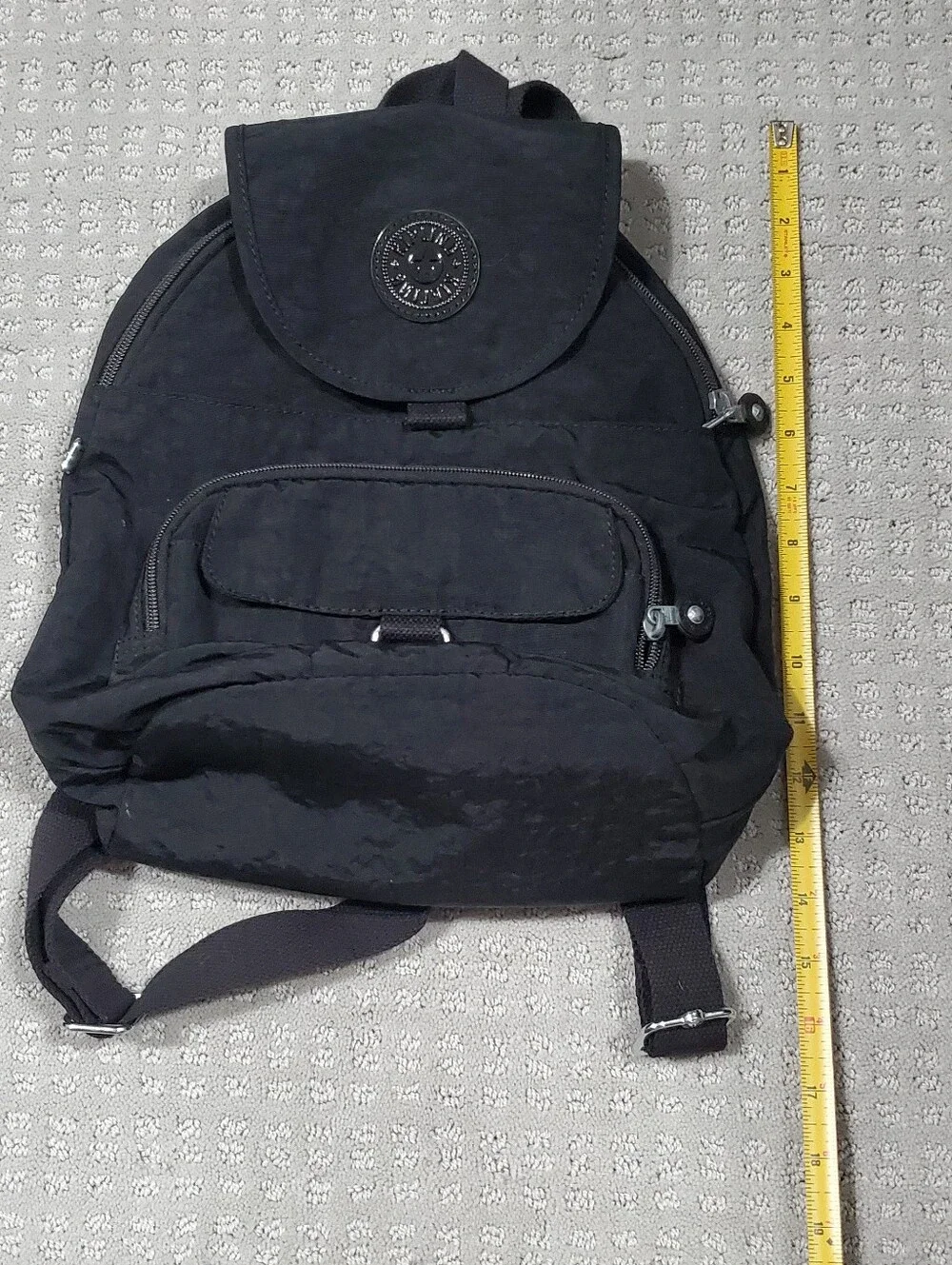 Kipling Queenie Small Backpack Black Nylon Brand Logo on the front flap.